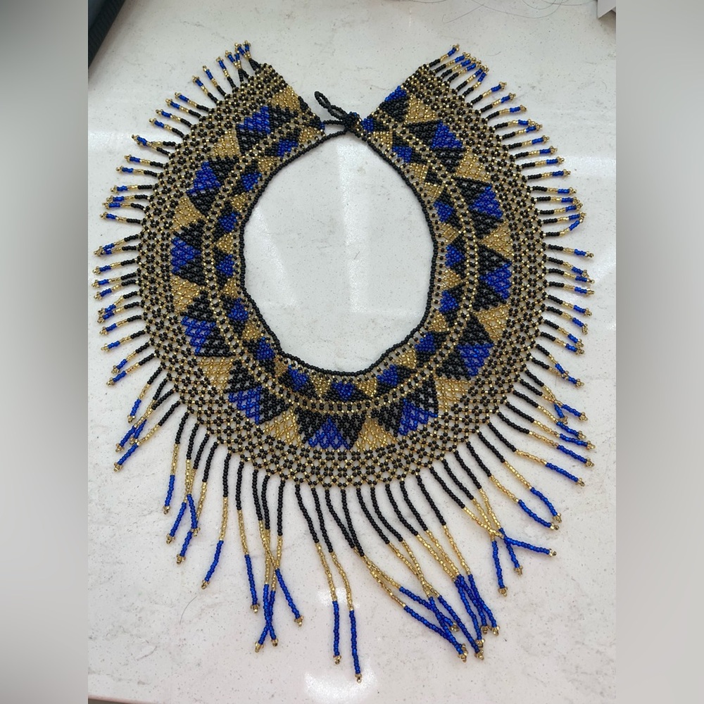 Handmade collar Necklace length: 16”Chain style: Bead Adjustable length